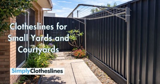 Ground Mounted Clothesline installed in a small courtyard yard with a colorbond fence behind it.
